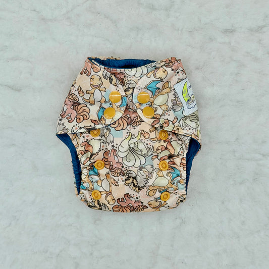Cosmic Cloth & Company Pokémon Evolutions Newborn All-in-One Diaper with Pocket - Brand New